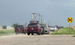 Storm Chaser Vehicles  line the road